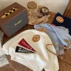 Children's hoodie 2024 fabric with sugar Winter new collection: Cute cartoon fleece hoodie for boys and girls, versatile top for babies Application Scenario